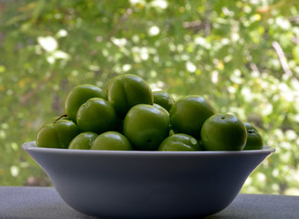fresh and organic plums on the plate