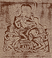 Fototapeta na wymiar Historic Khmer bas-relief with dancing Hindu goddesses
