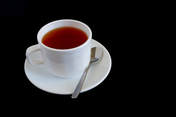 Herbal tea in a white mug on a black background. Suitable for advertising backgrounds and mockups