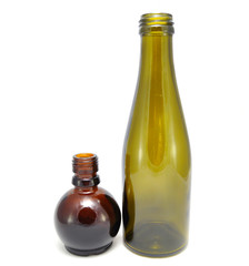 Brown glass bottle on a white background close up