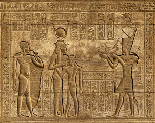 Fototapeta na wymiar Hieroglyphic carvings in egyptian temple