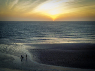 Amazing sunset in Jericoacoara beach in Ceara, Brazil, with three people silhouette. Famosu place