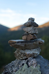 Pile of stones stacked on top of each other on the mountain