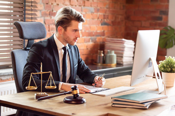 Lawyer working in office. Law and justice concept
