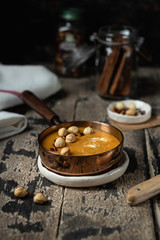 Vegan Carrot Soup with Lentils on a wooden background, selective focus