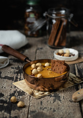Vegan Carrot Soup with Lentils on a wooden background, selective focus