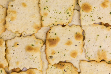 background of mediterranean crunchy cracker with black and green olives
