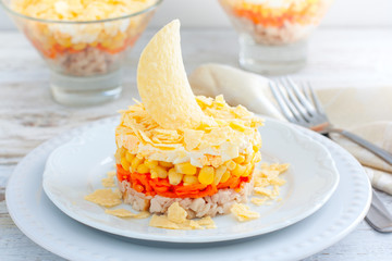 salad with corn, carrots, chicken and chips, salad Sail, selective focus