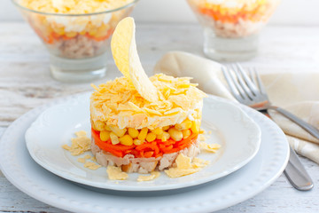 salad with corn, carrots, chicken and chips, salad Sail, selective focus