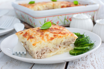 Potato casserole with minced meat on a plate, selective focus