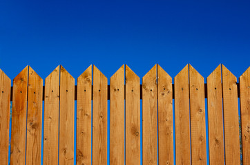 yard wooden fence palisade garden object vivid blue sky background and empty copy space for your text