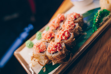 Large set of Sushi Rolls Warm Ebi Sake Unagi Spring. A lot assortment Philadelphia roll Dishes from Japanese raw fish  in one plate in traditional restaurant. Japan food menu service