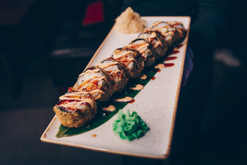 Large set of Sushi Rolls Warm Ebi Sake Unagi Spring. A lot assortment Philadelphia roll Dishes from Japanese raw fish  in one plate in traditional restaurant. Japan food menu service