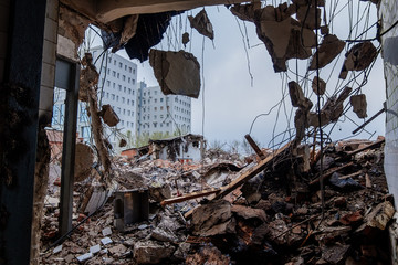 Ruins of old demolished industrial building. Disaster or war consequences concept