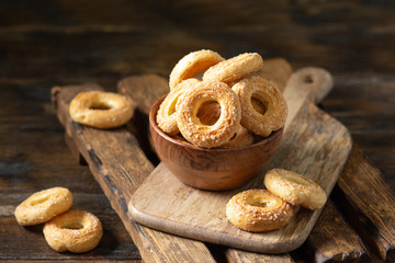 Sprinkle the puff pastry with sugar in a wooden bowl on a wooden table. Sprinkle the cookies with sugar. Sweet pastries