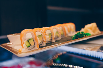 Large set of Delicious sushi rolls view from above Flat Lay . A lot assortment Philadelphia roll Dishes from Japanese raw fish  in one plate in traditional restaurant. Japan food menu service