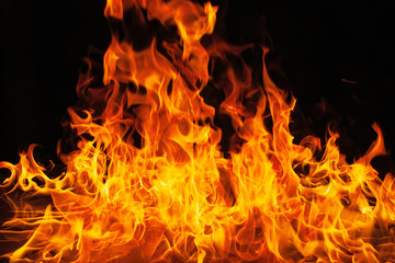 Fire flames on black background. Blaze fire flame texture for background