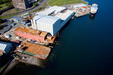 Fototapeta na wymiar Shipbuilding construction ship aerial view at shipyard harbour with scaffold