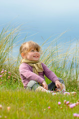 cute little girl enjoying nature in spring