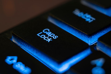 macro shot of a blue keyboard  button Caps Lock