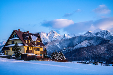 Tatra Mountains - Giewont, Czerwone Wierchy, regle - winter panoramic view with clouds, snow,...