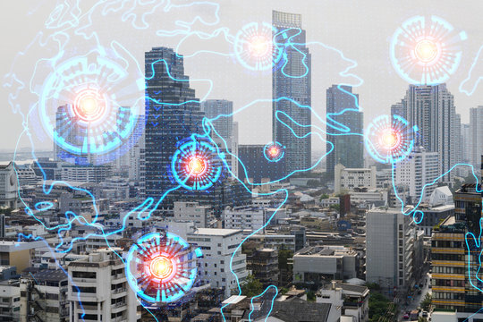 Multi exposure of Bangkok cityscape day time and world map hologram. Concept of media networking.