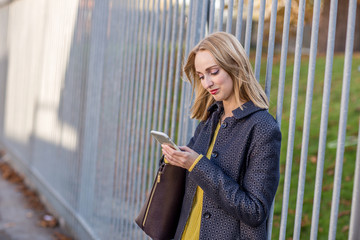 a beautiful woman checking her text messages