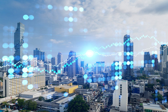 Day time bright Bangkok city background with business chart grid. Success and finance concept. Doublexposure