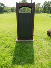 Modern brown wooden trash bin