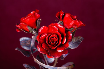  red roses made of metal as symbol of immortal love