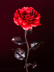 unfading crimson metal rose as symbol of everlasting love
