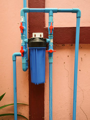 Pipes connected by water filters and water valves.
