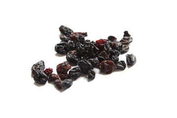 Raisins isolated on white background. Heap of dried red grapes