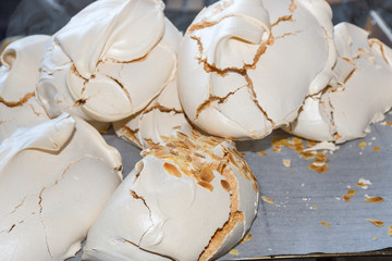 Fototapeta na wymiar Meringue. sweet meringue. Tray of meringues. Close up meringue photo. Dessert background