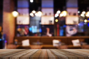 wooden table with abstract blurred background resturant lights used for display montage products mock up design.