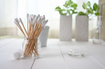 White cotton swabs cotton bud and cotton ball on background