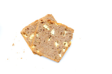 Homemade healthy bread made with spelt, gouda cheese and yeast, bread is imperfect but homemade and on a white background, the cheese is clearly visible within the bread