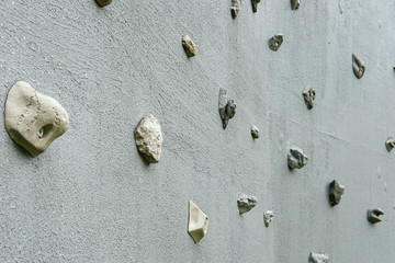 Outdoor climbing wall, an artificially constructed wall with grips for hands and feet.
