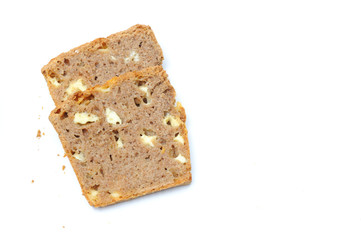 Homemade healthy bread made with spelt, gouda cheese and yeast, bread is imperfect but homemade and on a white background, the cheese is clearly visible within the bread