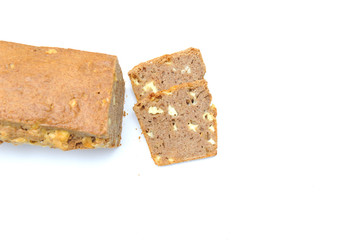 Homemade healthy bread made with spelt, gouda cheese and yeast, bread is imperfect but homemade and on a white background, the cheese is clearly visible within the bread