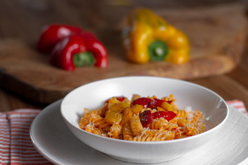 pasta with pepper cream and pieces of red and yellow pepper