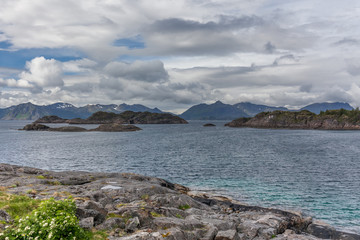 Fototapeta na wymiar End of fjord. Beautiful Norwegian landscape. view of the fjords. Norway ideal fjord reflection in clear water In cloudy weather. selective focus