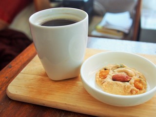 A homemade cookie with hot coffee