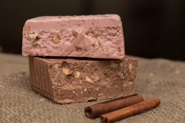 strawberry and milk chocolate lined with pile. Wooden background.