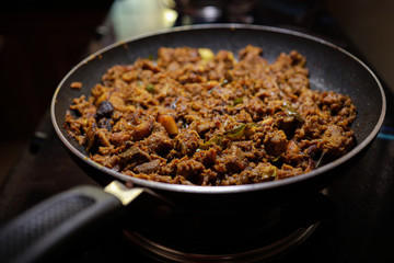 South Indian dish spicy beef fry Kerala, India. side dish ghee rice, appam, parotta, puttu, bread and chappathi, Kerala cuisine ,Buffalo roast / Meat pepper fry with coconut. India spices cooking,