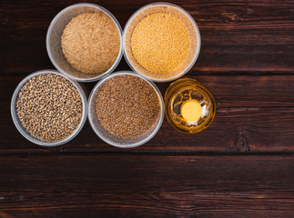 Various cereals and a bottle of sunflower oil. Raw porridge, food supplies in the kitchen.