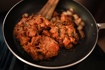 South Indian dish spicy beef fry Kerala, India. side dish ghee rice, appam, parotta, puttu, bread and chappathi, Kerala cuisine ,Buffalo roast / Meat pepper fry with coconut. India spices cooking,