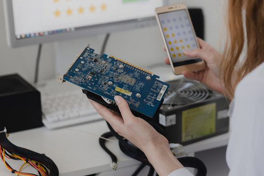 Electronics technology concept. Young woman online shopping gpu Graphics Proccesing Unit white background room voting