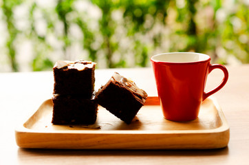 Chocolate flavor Brownie dessert and red cup coffee for food and drink backgrounds