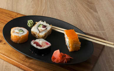 japanese sushi on a black plate